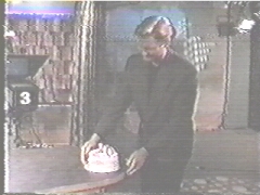 Craig with the 100th episode cake...a few seconds later he accidently drops it on the floor.